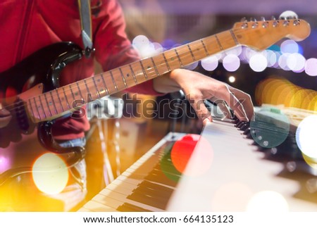 Guitar and piano keyboard detail.Live music and concert background Foto d'archivio © 