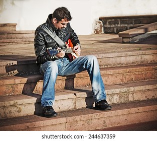 Guitar Player On The Stairs In Vintage Tone Effect