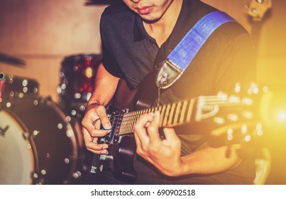 Guitar Player Playing Song. Processing In Vintage Style.