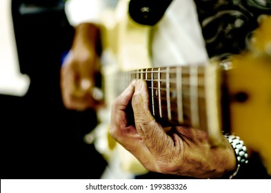 Guitar Playing with dramatic hands