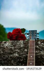 Guitar And Roses Laying On The Fence Of Roman Bridge In Sarajevo, Bosnia And Herzegovina