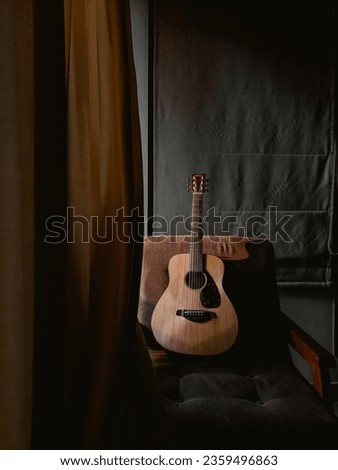The guitar is a string instrument which is played by plucking the strings. The main parts of a guitar are the body, the fretboard, the headstock and the strings.