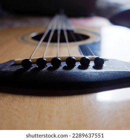 The guitar is a stringed instrument that is played by picking, generally using fingers or a plectrum. The guitar is made up of a main body with a solid neck where the six strings are attached. Guitars