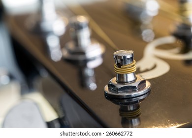 Guitar strings on a guitar's head - Shutterstock ID 260662772