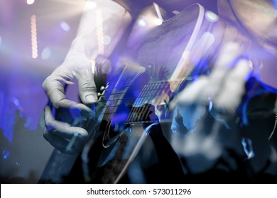 Guitarist with the audience in a double exposure.