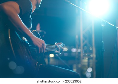 Guitarist on stage for background, soft and blur concept - Shutterstock ID 238323052