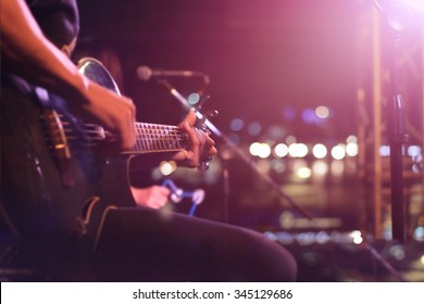 Guitarist on stage for background, soft and blur concept - Shutterstock ID 345129686
