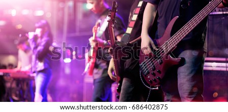 Guitarist on stage for background, soft focus and blur concept