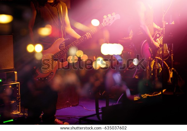 Guitarist\
on stage for background, soft and blur\
concept
