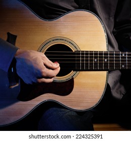 Guitarist Playing Acoustic Guitar. Unplugged Performance.