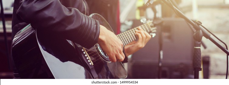 guitarist plays guitar sun day