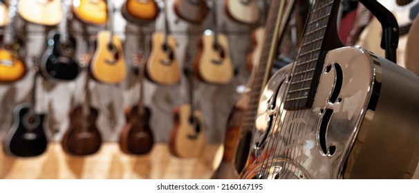 Guitars In A Store Focusing On F Hole