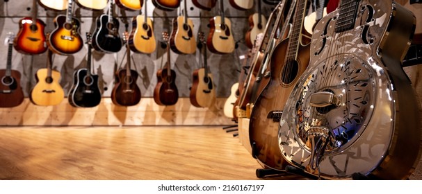 Guitars In A Store Focusing On F Hole