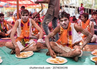 GUJARAT - INDIA - March 14, 2017: Rathva tribal wearing traditional dress eat food during the annual tribal Holi festival at Kawant village near Vadodara.