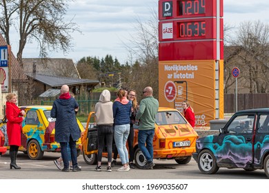Gulbene, Latvia - May 02, 2021: more colorful vintage cars Fiat 126 gathered at the gas station, a fun trip or adventure concept