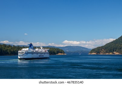 GULF ISLANDS, BRITISH COLUMBIA, CANADA - AUGUST 04, 2016:  BC Ferry passes Gulf Islands. BC Ferries provides an essential link from mainland British Columbia to the various islands.