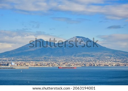 Gulf of Naples, mount Vesuvius and a big red cargo ship
