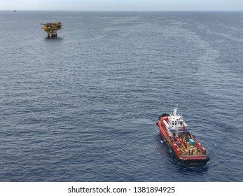 Gulf of Thailand, Thailand- 27 April,2 Offshore supply boat or Aerial View of Tender Drilling Oil Rig (Barge Oil Rig) in The Middle of The Ocean or gulf, Offshore tender rig barge with crane anoffshor