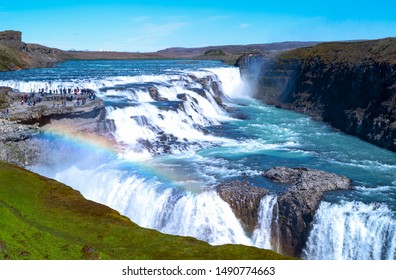 Gullfoss, Iceland - May 30 2019:  Golden Ring area,  view of the Gullfoss waterfalls with visitors on the left - Powered by Shutterstock