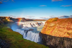 Gullfoss Waterfall, Also Known As The Golden Falls, And The Olfusa River In Southwest Iceland With A Rainbow. Long Exposure.