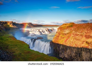 Gullfoss waterfall, also known as the Golden Falls, and the Olfusa river in southwest Iceland with a rainbow. Long exposure. - Powered by Shutterstock