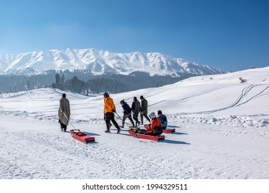 Gulmarg, Kashmir, India - January 30, 2021 : Tourist Enjoying Sledge, Gulmarg, Kashmir, India