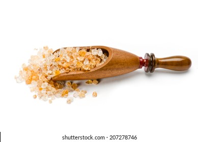 Gum arabic in a wooden scoop 
