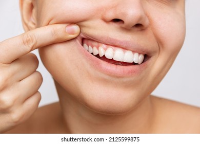 Gum health. Cropped shot of a young woman showing healthy gums. Dental care, dentistry concept