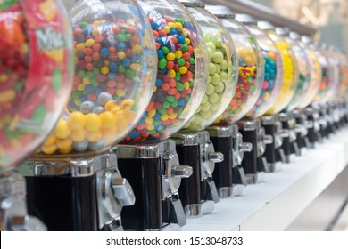 Gumball machines in a row close angle