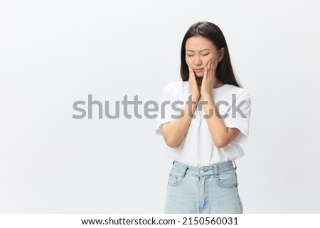 Gumboil Dental abscess Toothache Broken Tooth. Unhappy crying suffering tanned beautiful young Asian woman touch cheek at home interior living room. Injuries Poor health Illness concept. Cool offer