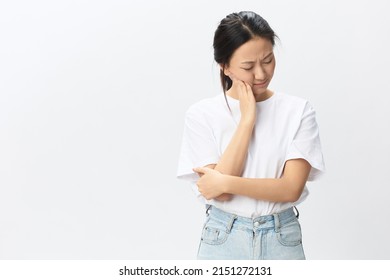 Gumboil Dental Abscess Wisdom Teeth Periodontitis. Unhappy Suffering Tanned Pretty Young Asian Woman Touch Cheek Posing Isolated On White Background. Injuries Poor Health Illness Concept. Cool Offer