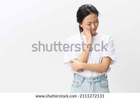 Gumboil Dental abscess Wisdom teeth Periodontitis. Unhappy suffering tanned pretty young Asian woman touch cheek posing isolated on white background. Injuries Poor health Illness concept. Cool offer