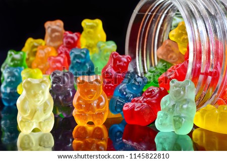 Gummy bears on the beach background