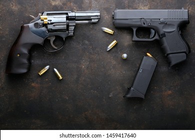 Gun with ammunition on iron dark background., Colts and Magnum gun