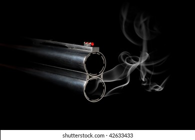 Gun Barrel With Smoke On Black Background