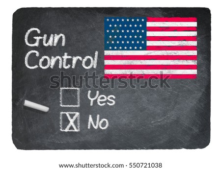 Gun Control choice using chalk on slate blackboard