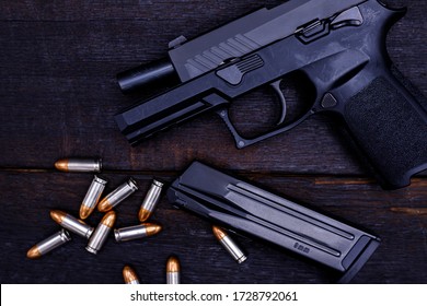 
Gun is a dangerous weapon on a black background.