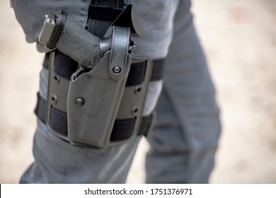 Gun In Gray Holster Walking