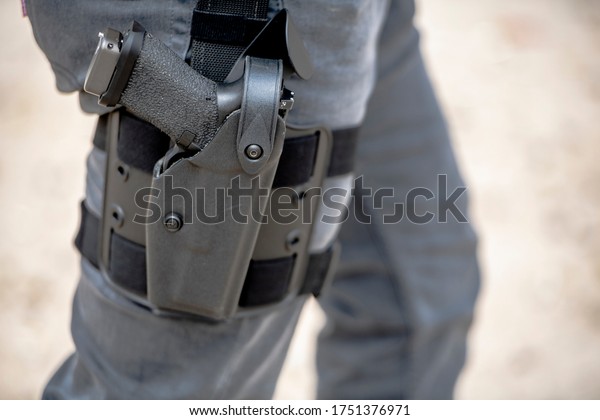 Gun in Gray Holster\
walking