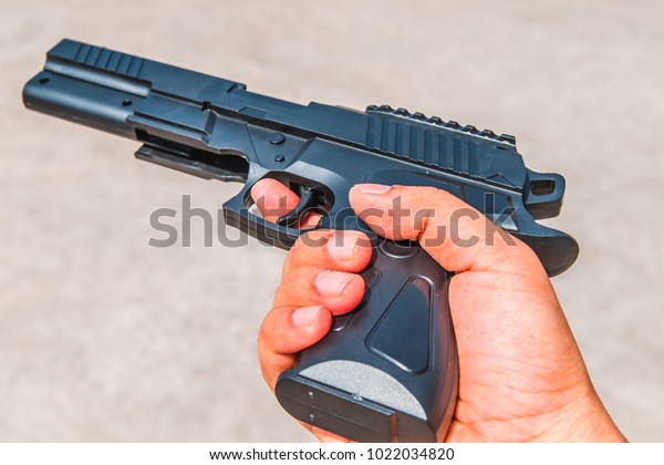 gun in\
hand