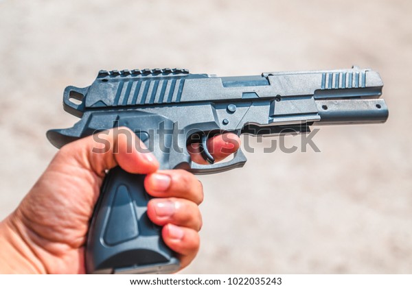 gun in
hand