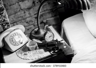 Gun On Bedside Table. Film Noir Style Vintage Items