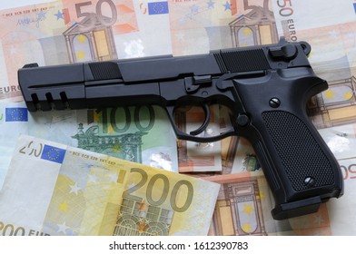 gun on euro banknotes. concept image