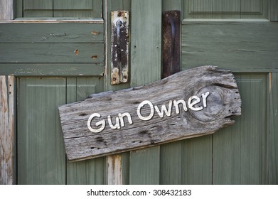 Gun Owner Sign On Old Green Doors.