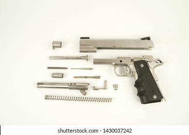 Gun Parts Of The 1911 Gun Model On A White Background.