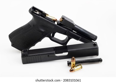 Gun Parts Of Automatic Hand Gun With 9 Mm Bullets On A White Background 