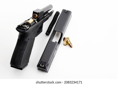 Gun Parts Of Automatic Hand Gun With 9 Mm Bullets On A White Background 