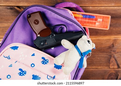 A Gun In A School Bag. Concealed Carrying Of Weapons For Protection. School Guns, School Assault, Shooting.