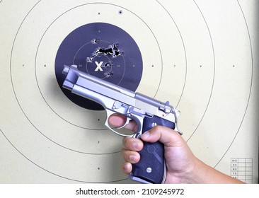 Gun and shooting target With Bullet Holes. Classic Paper Shooting Target. Holes In Target. For Sport, Hunters, Military, Police. Sport shooting circle target accuracy bullet hole.
