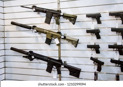 Gun Wall Rack With Rifles And Pistol.